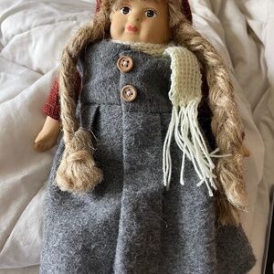 Porcelain doll with skis